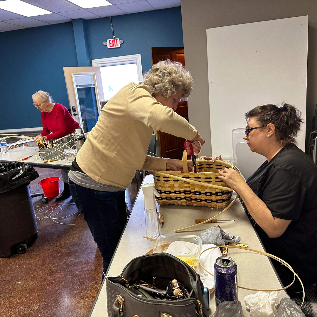 Women Weaving A Basket