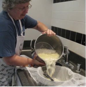 Woman making cheese