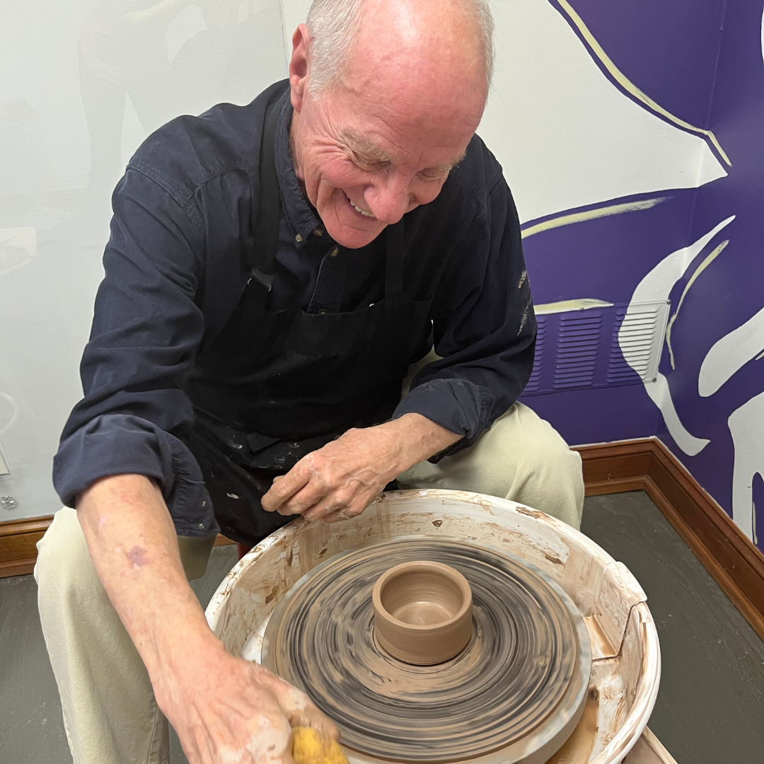 Man Wheel Throwing a ceramic 