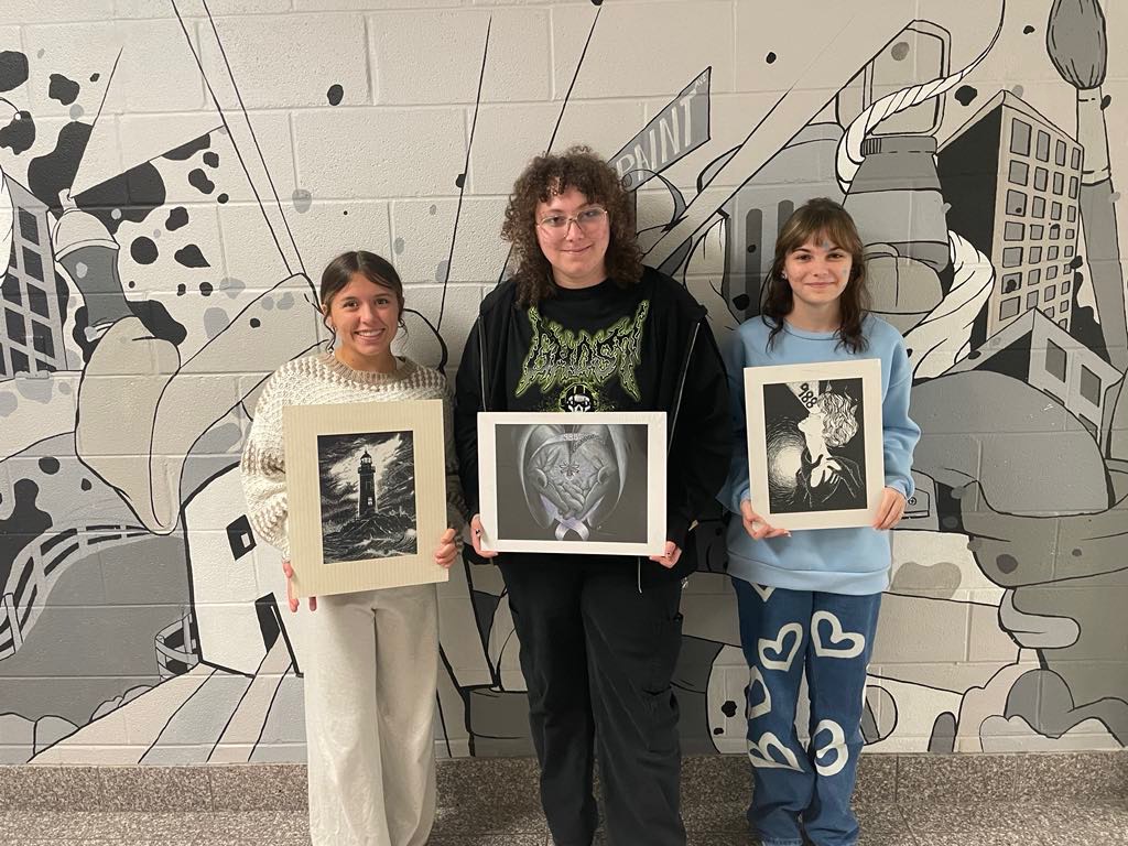 Kids holding drawings 